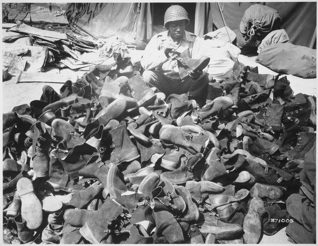 -Pfc._Robert_Askew...with_the_3278th_Quartermaster_Company,_examines_overshoes_which_have_been_turned_in._Overshoes_prov_-_NARA_-_531412.tif -Pfc._Robert_Askew...with_the_3278th_Quartermaster_Company,_examines_overshoes_which_have_been_turned_in._Overshoes_prov_-_NARA_-_531412.tif